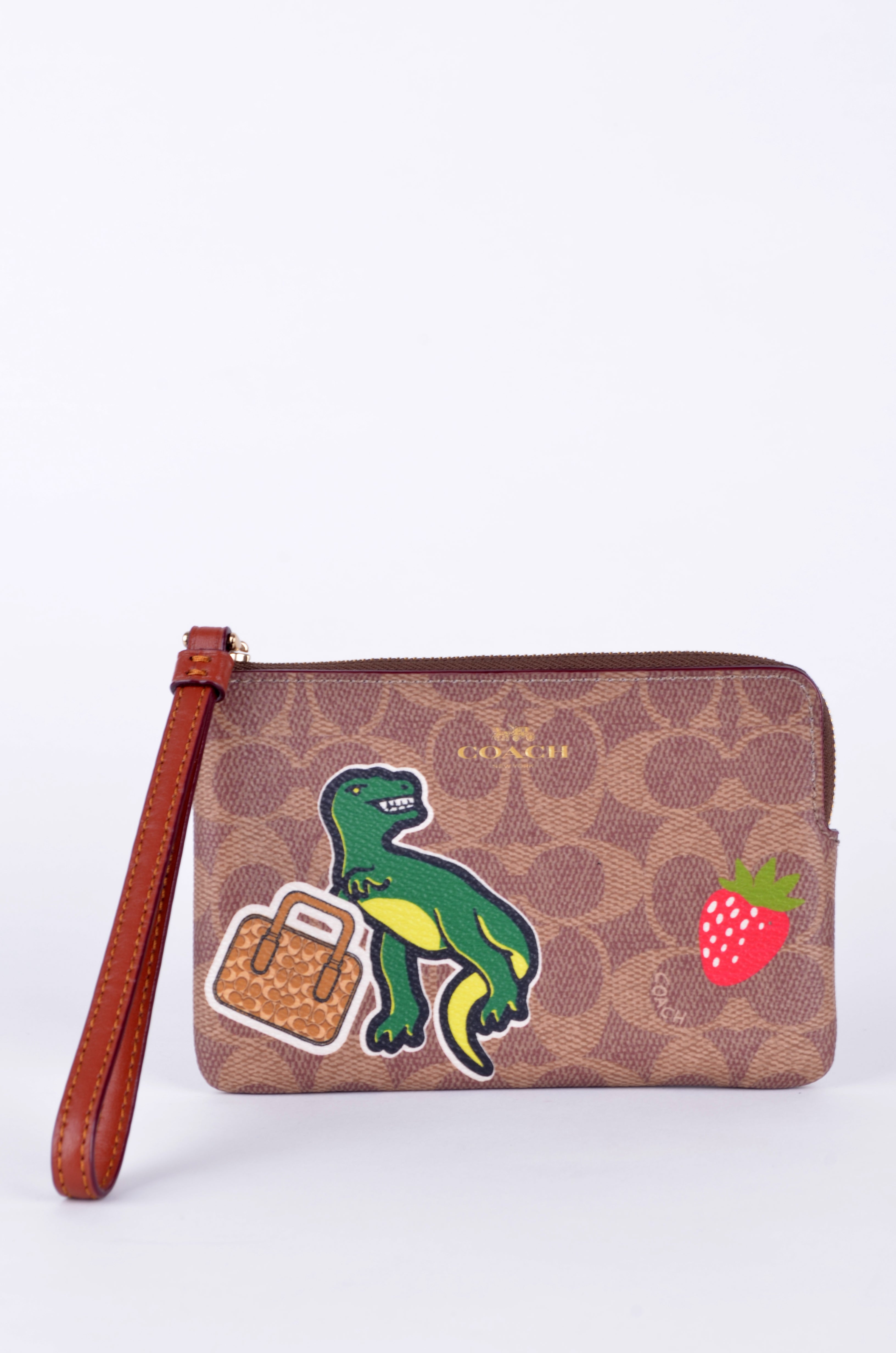 Muñequera Coach Signature Café con Parches