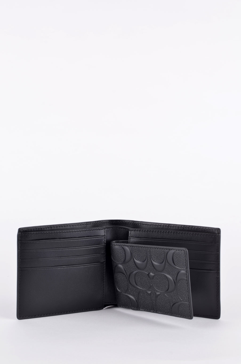 Cartera Coach Negra Signature en Relieve